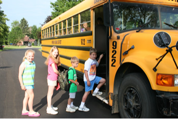 Students boarding a school bus