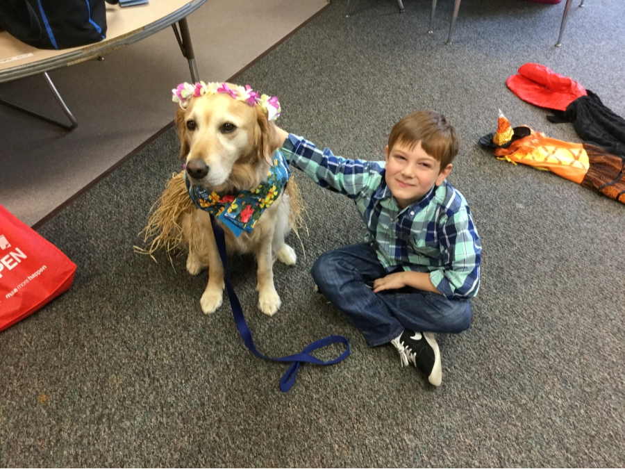 Elementary student with their therapy dog