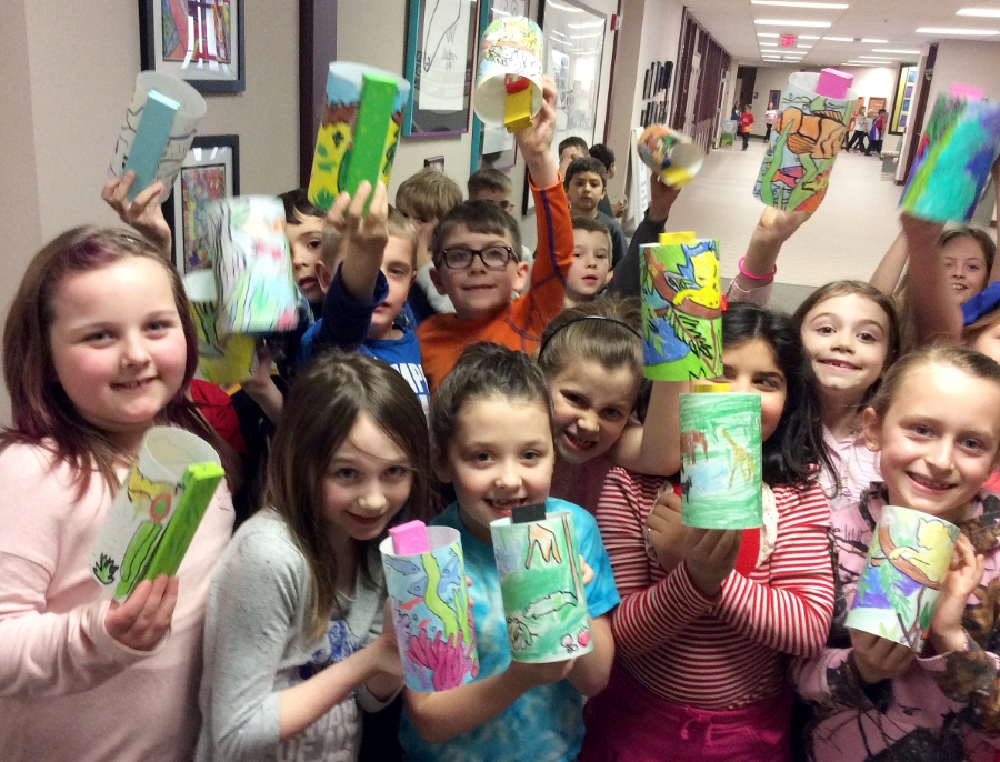 Elementary students showing their Biomes projects