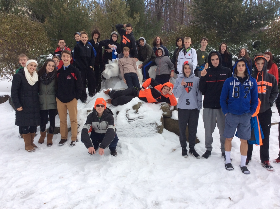 Student posing around the Nittany Lion at PennState Behrend for a Career Fair