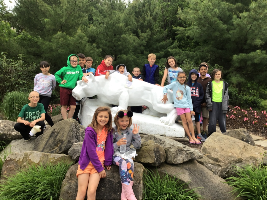 Elementary students posing with the Nittany Lion at PennState Behrend