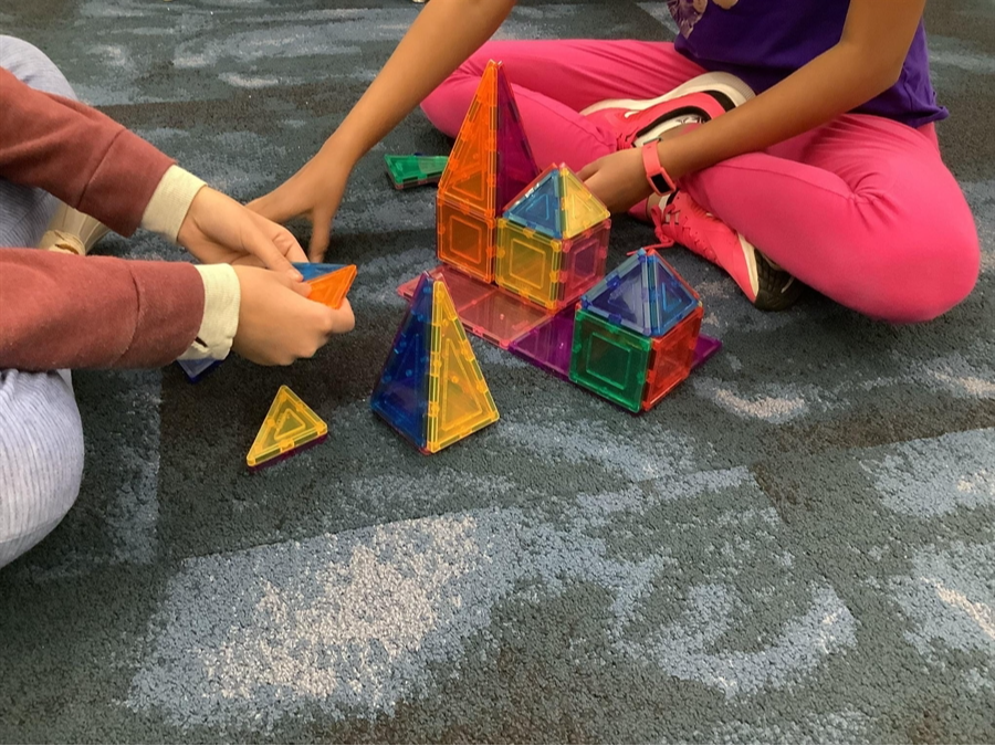 Students working with Three-dimensional geometry tiles