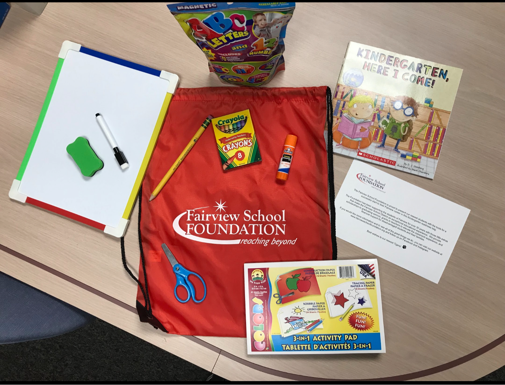 Kindergarten Readiness Kits  with essentials like crayons, glue, pencils and books