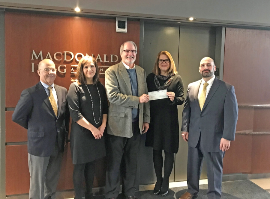 2019 MacDonald Illig EITC check presentation photo