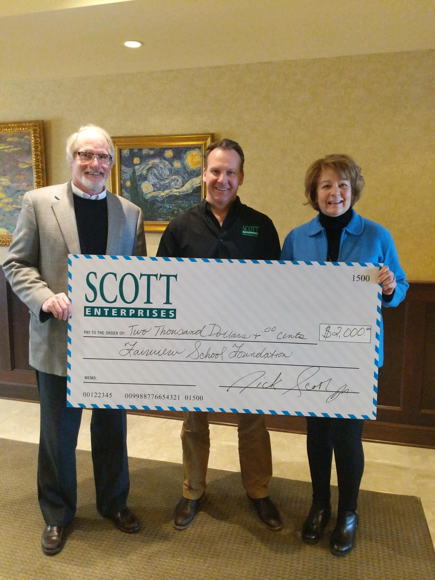 Scott Enterprises EITC check presentation photo.