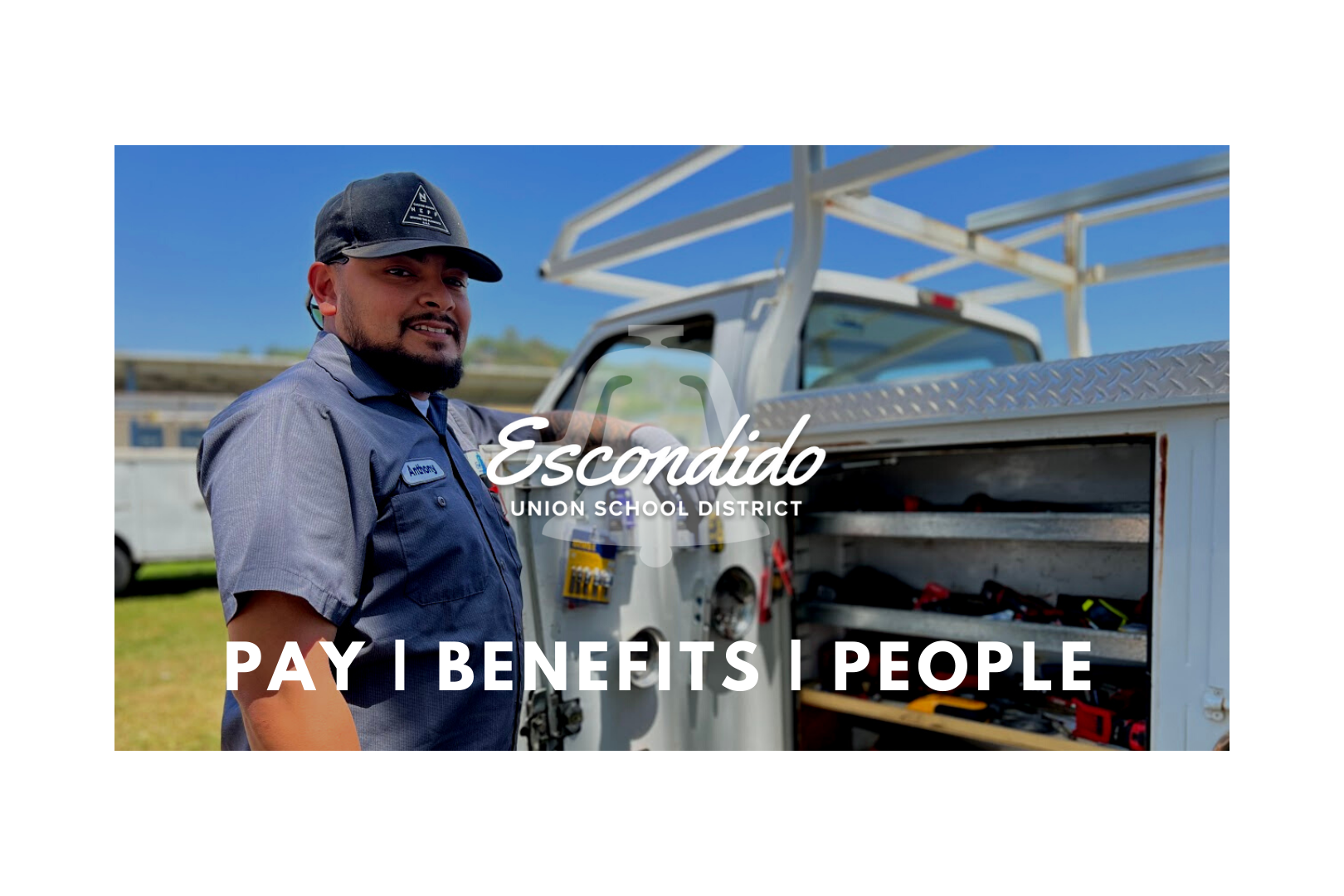 Escondido Union School District staff person standing next to his work truck