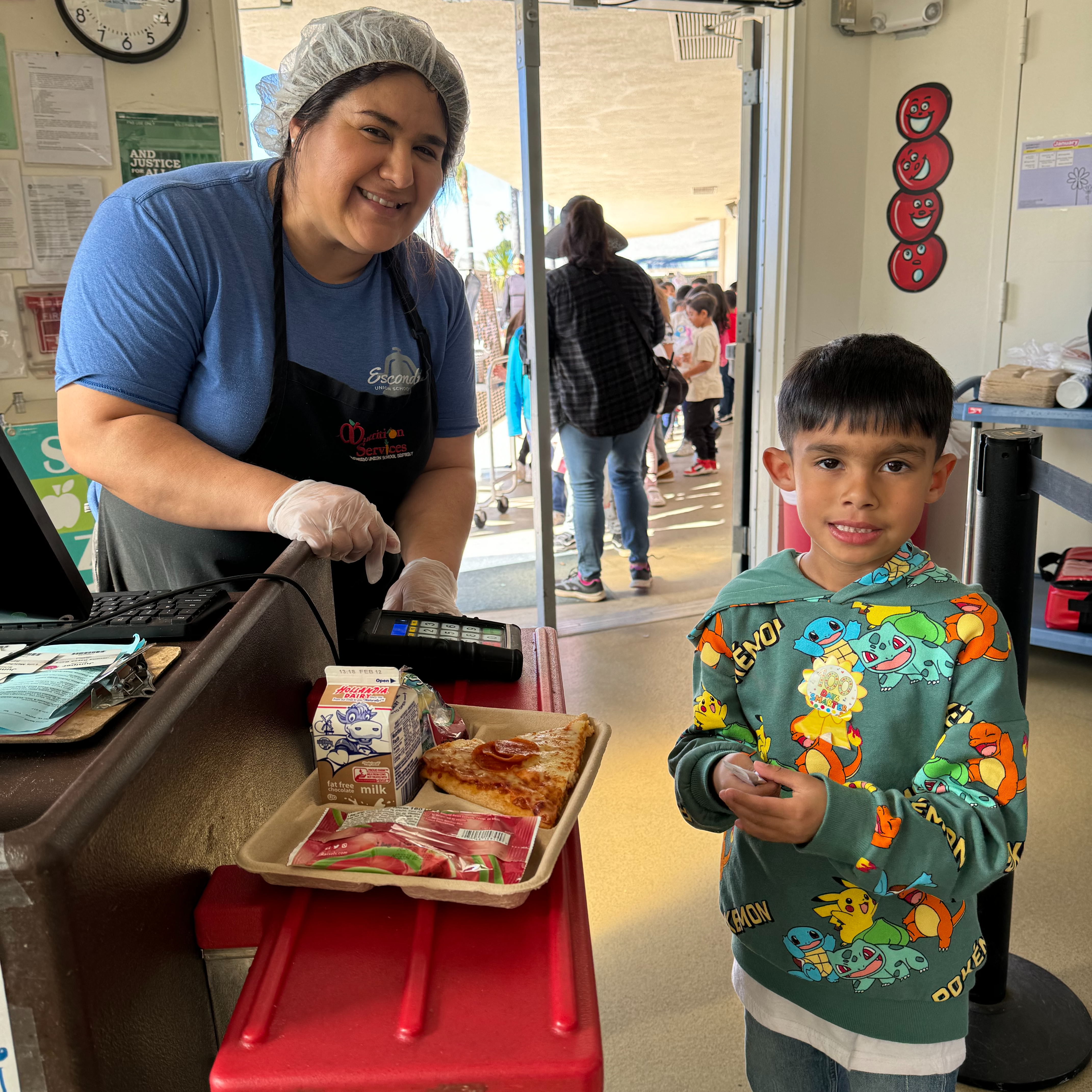 Kitchen manager with student 