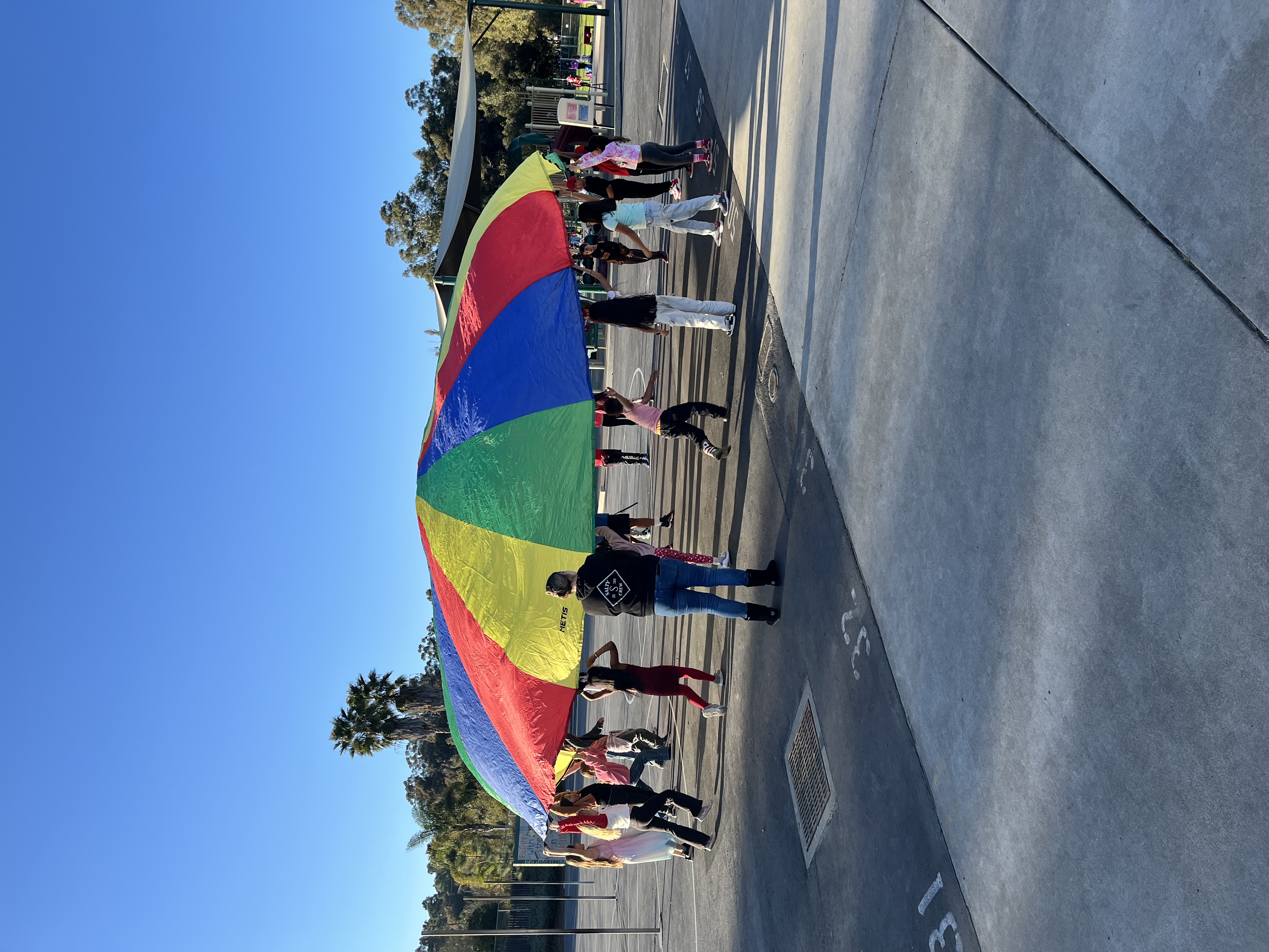 Students playing parachute in the after school program