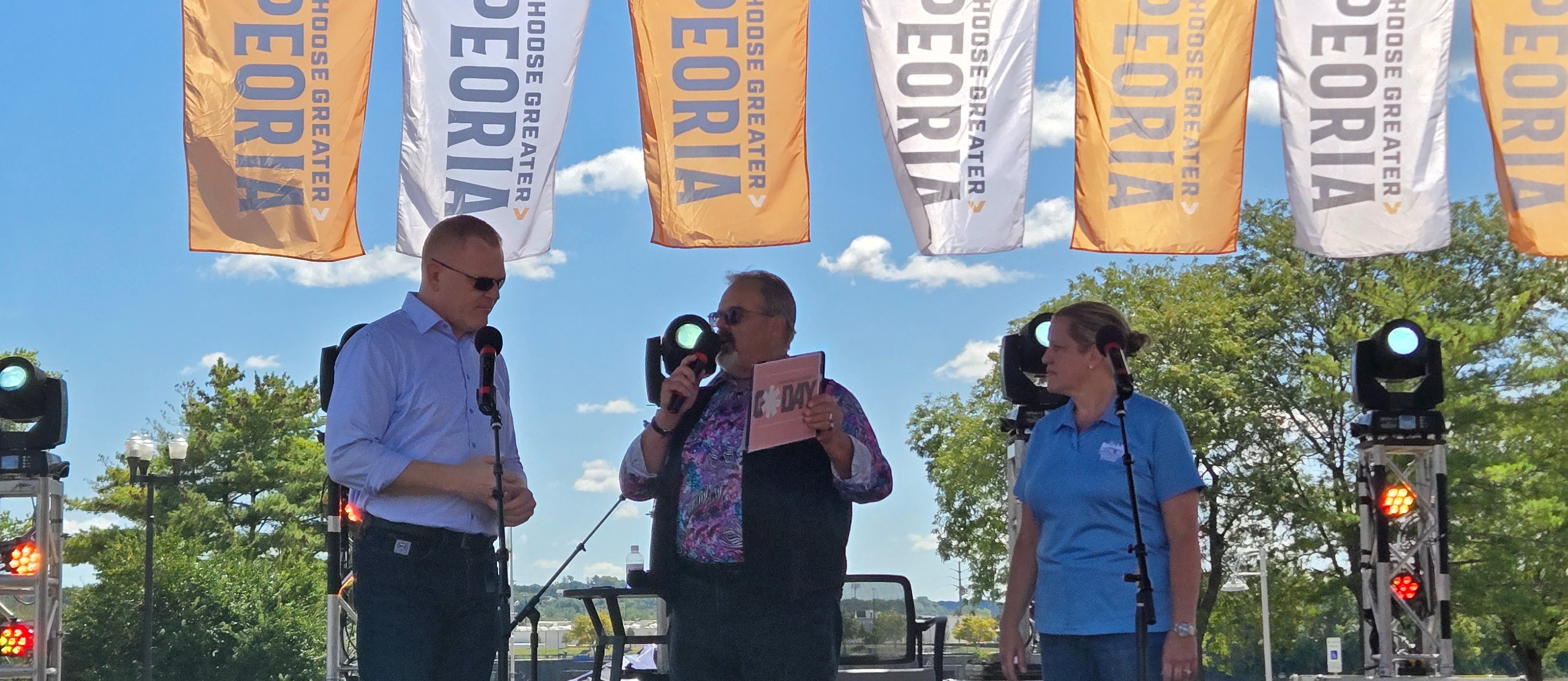 Regional Superintendent George McKenna and Assistant Superintendent Amy Smith  discussing the importance of the arts at Go Day 2025!