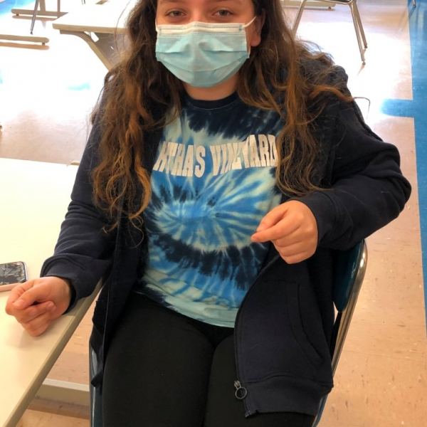 Student Sitting at desk with protective mask on