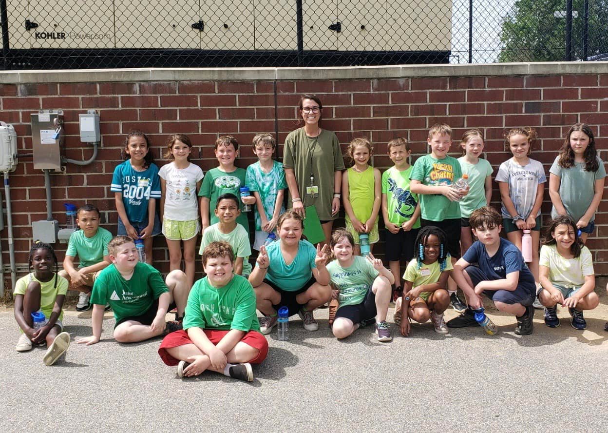 A group of second grade students poses on field day