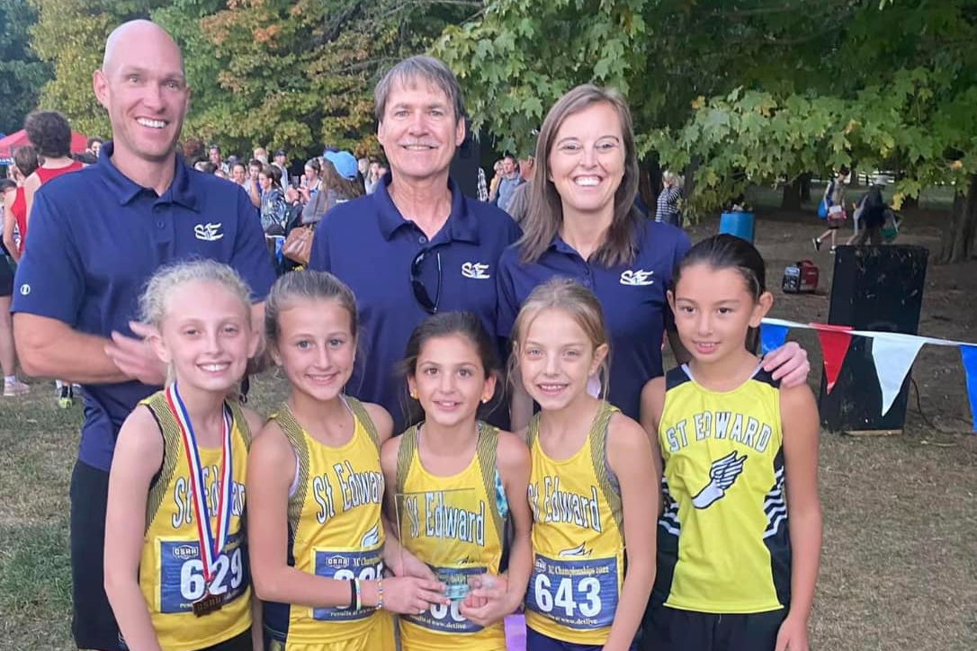 St. Edward cross country runners and coaches