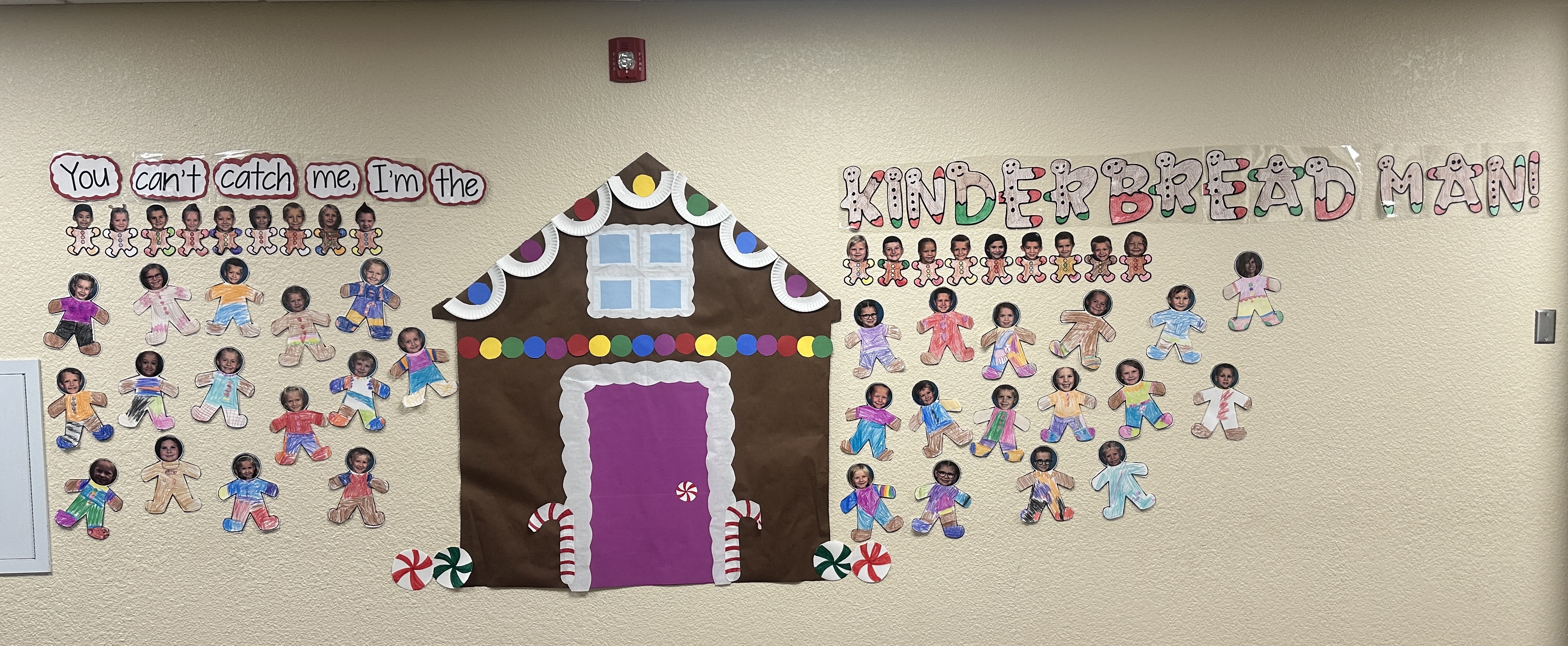 gingerbread house with student photos as gingerbread people