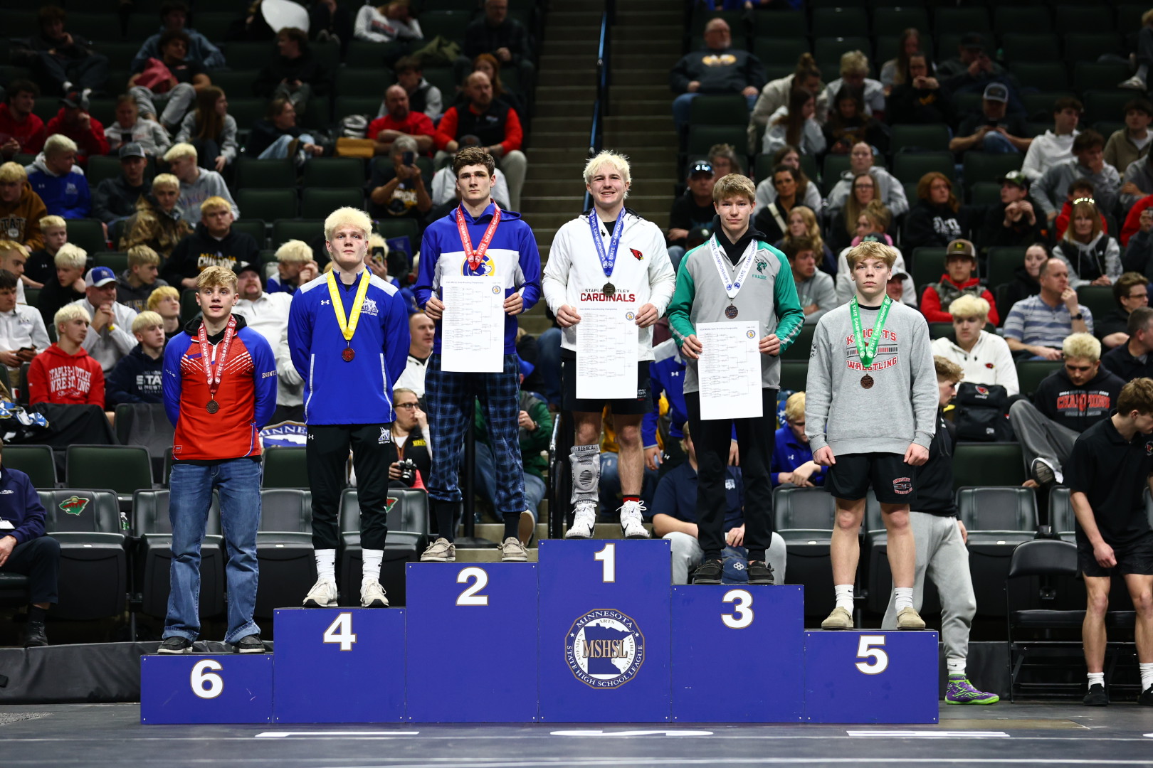 state wrestling winners on podium