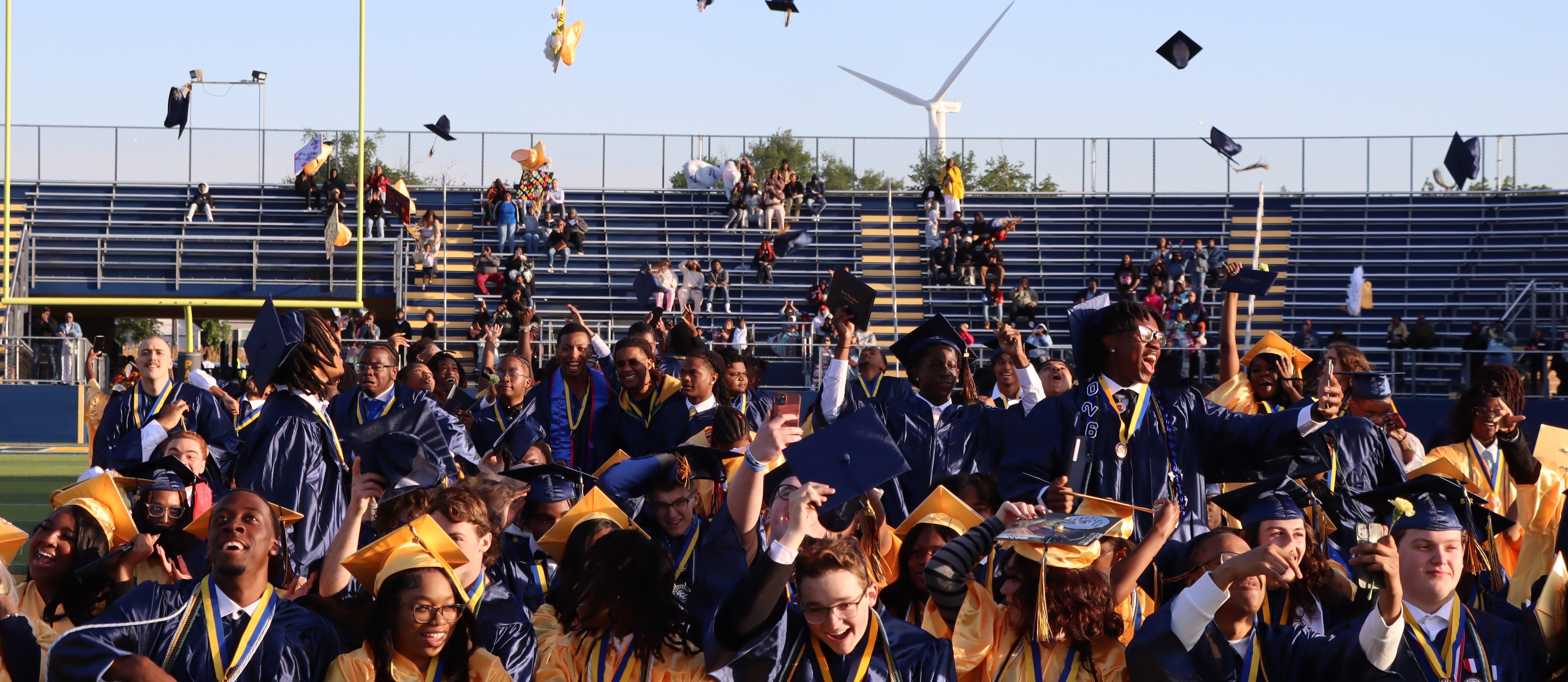 Students tossing their cap during graduation