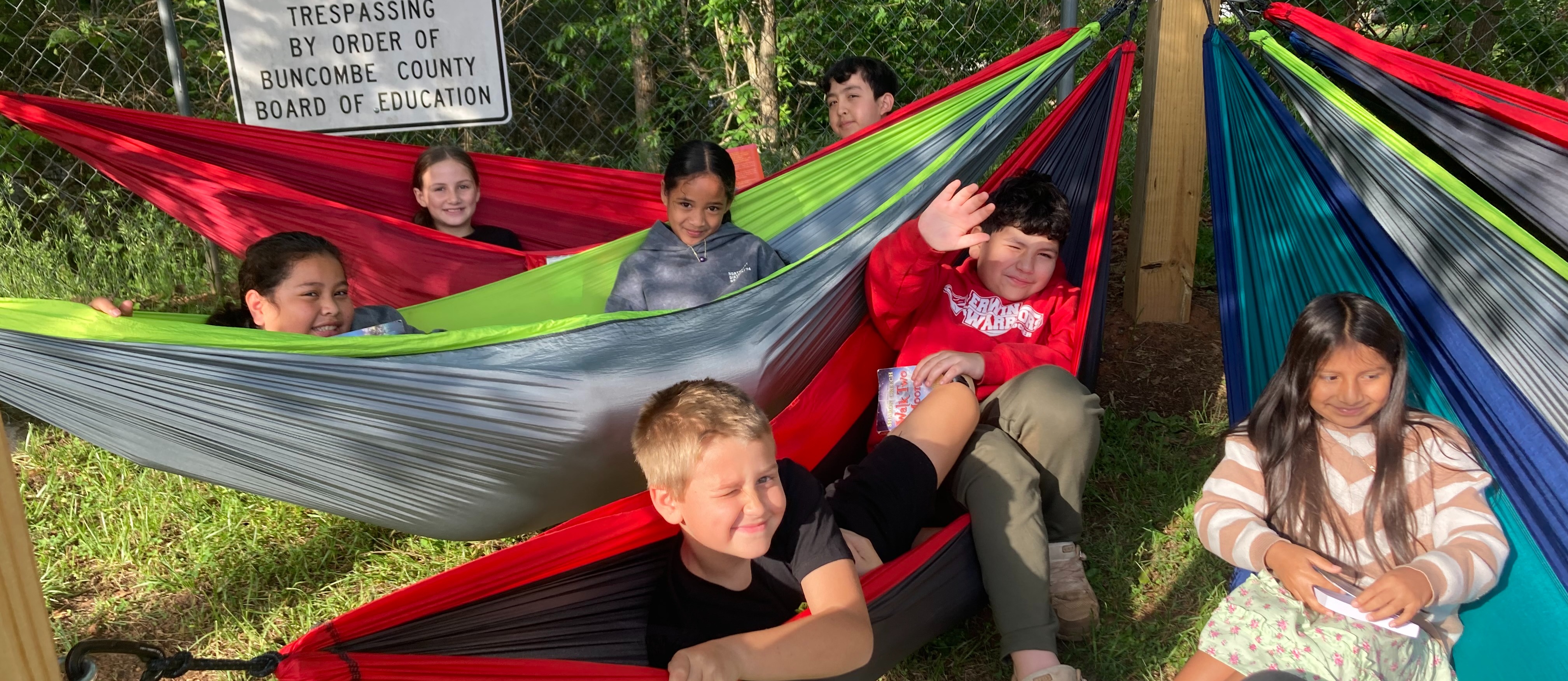 students reading in hammocks