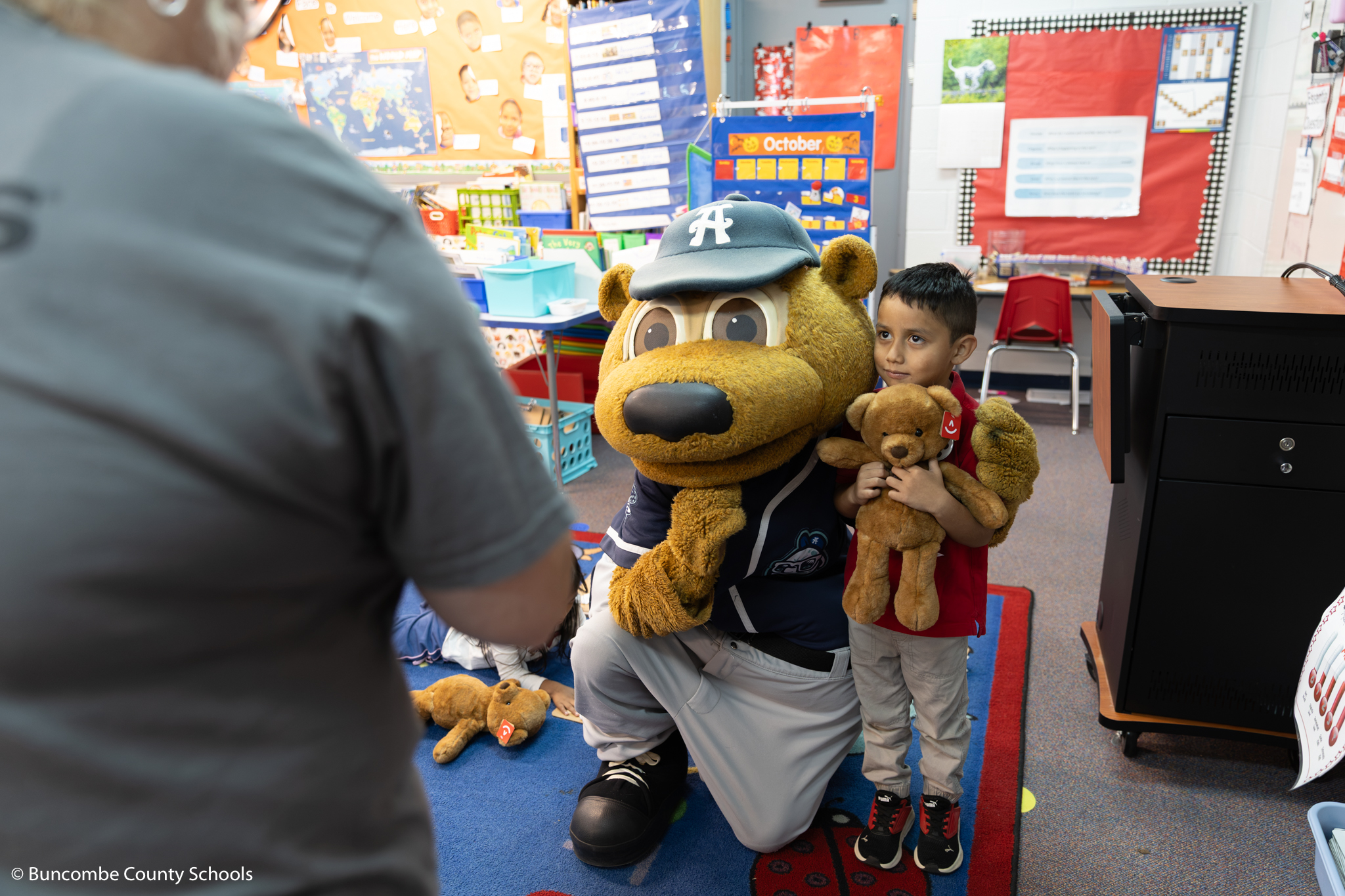 Little boy with Ted E. Tourist. 