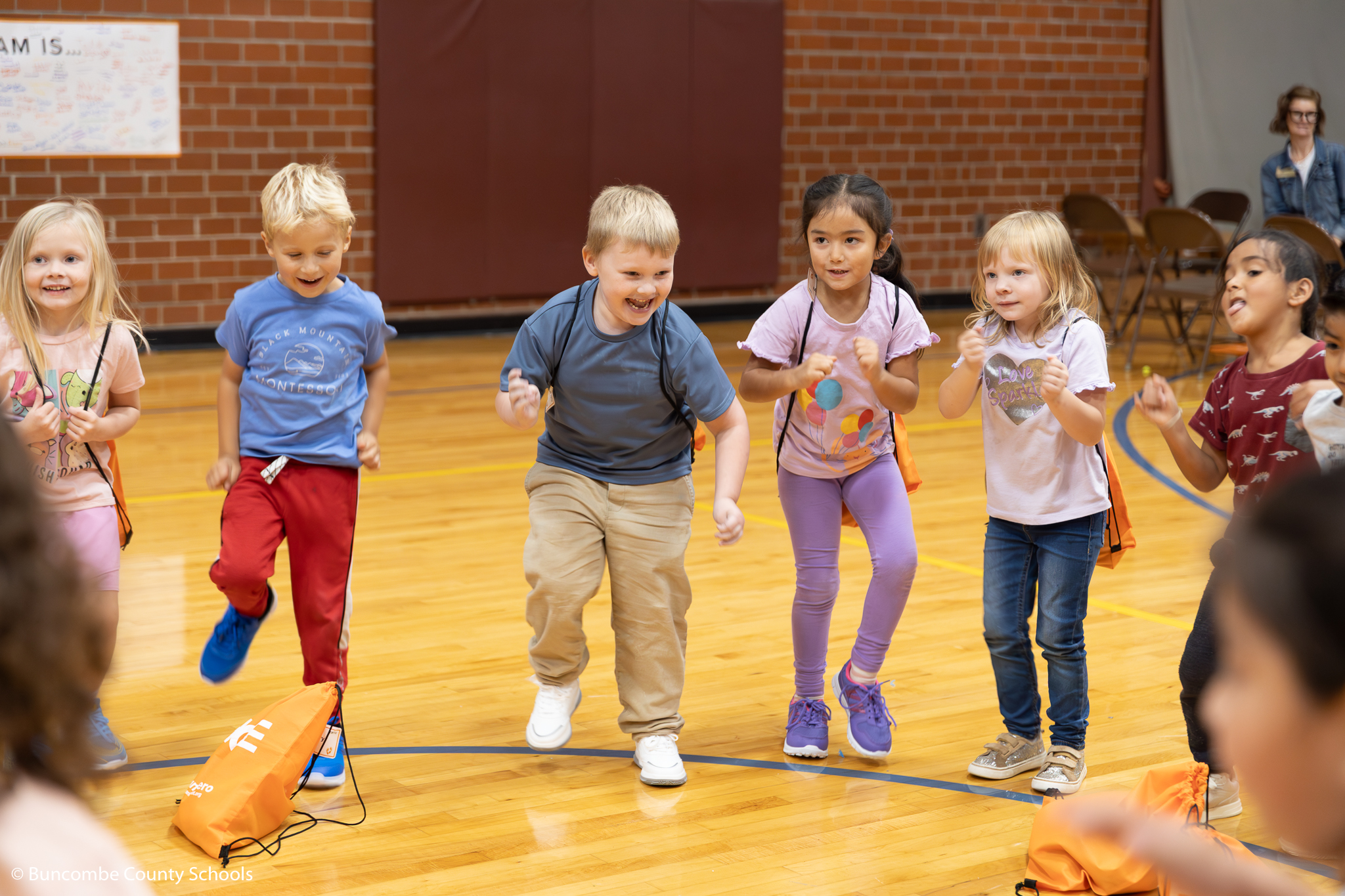 Group of Kindergarten students running in place. 