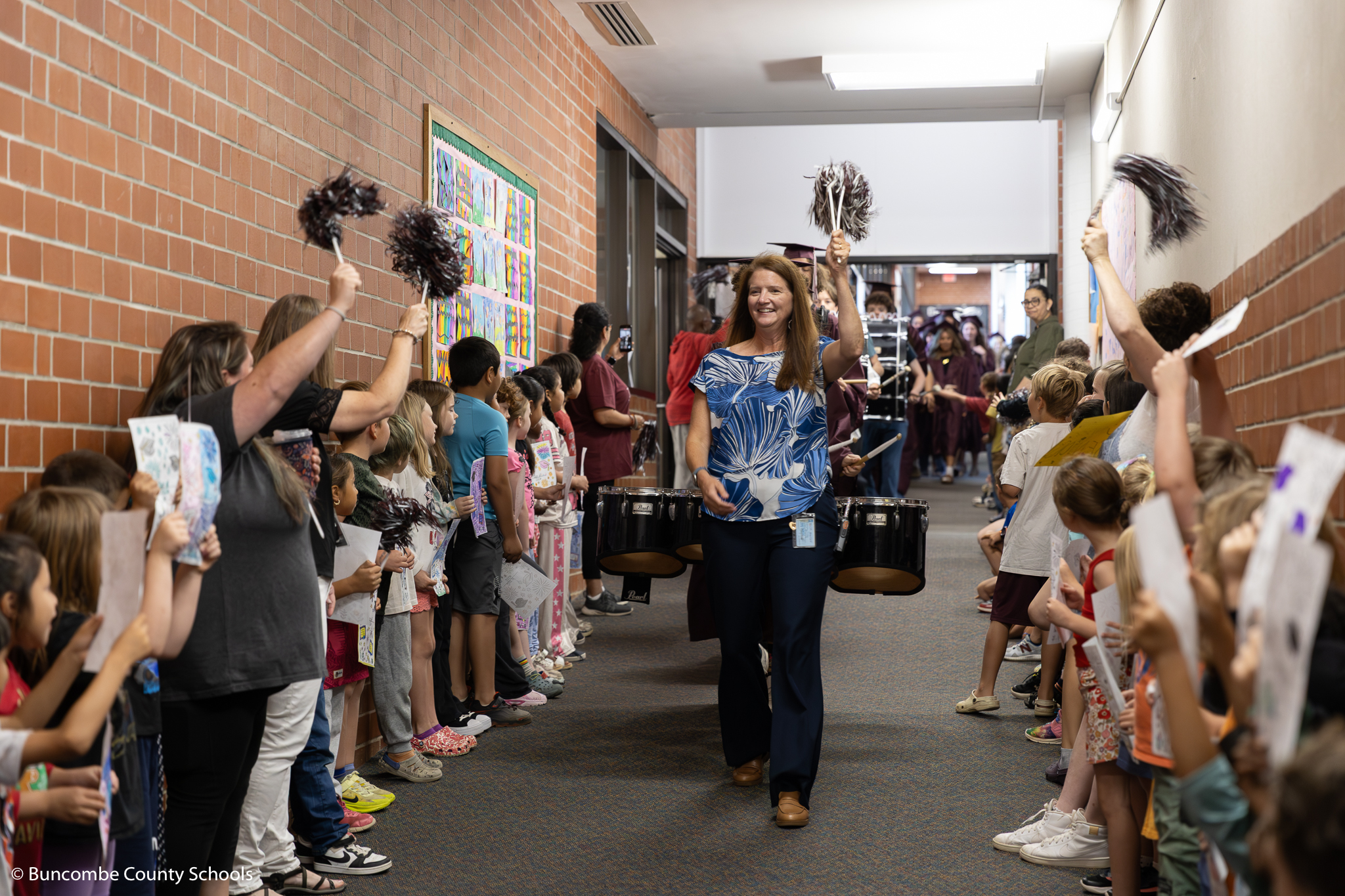 Principal Christy Jones leading the class of 2026 seniors through the school for the annual senior walk. 