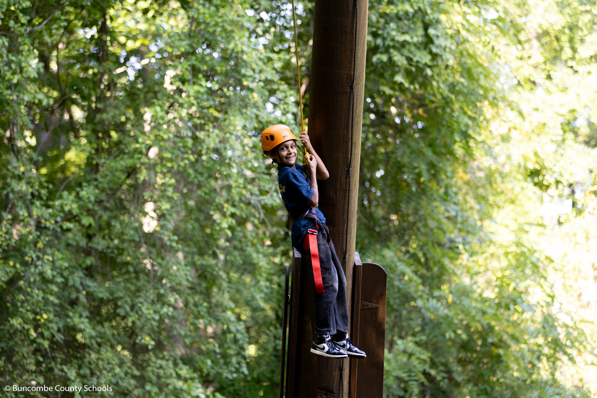 Student coming down from the ropes course at the Blue Ridge Assembly. 