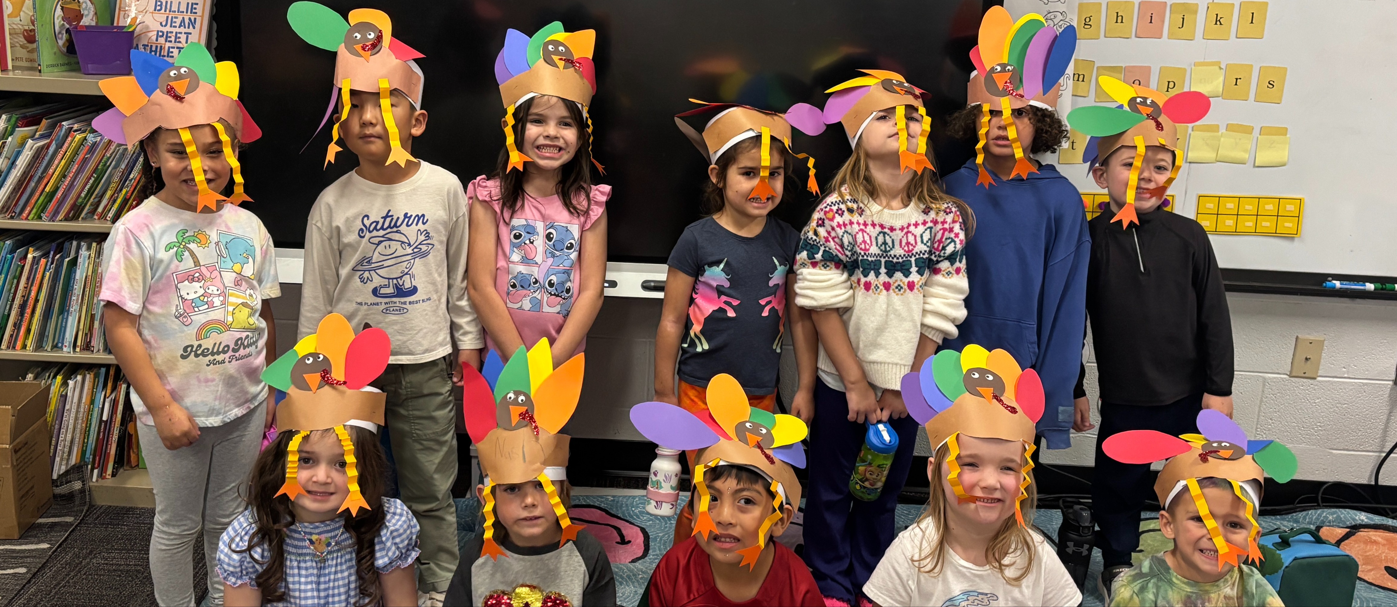 Mrs. McAneney's Kindergarten Class wearing turkey hats