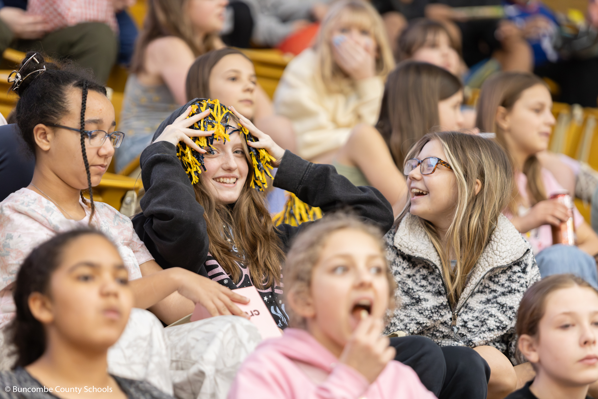 Students cheering on the college basketball teams at the SoCon Tournament. 