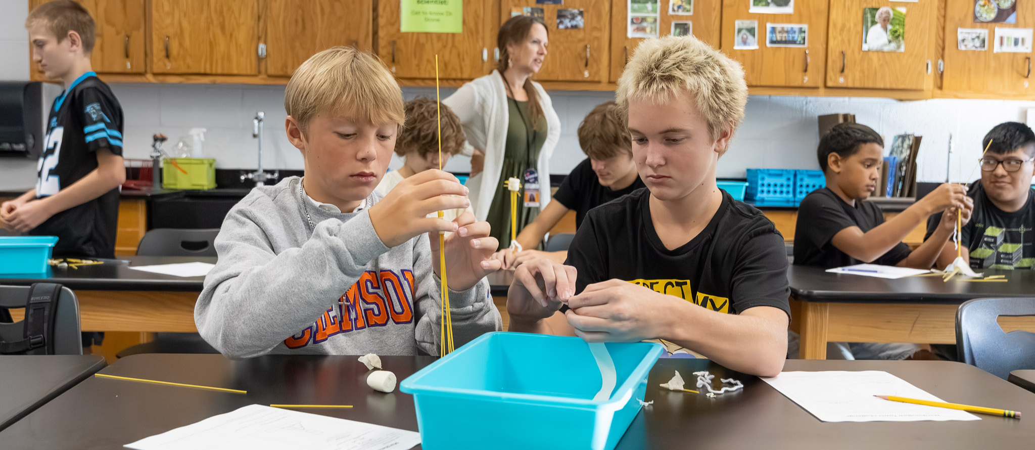 Two students work on a science project.