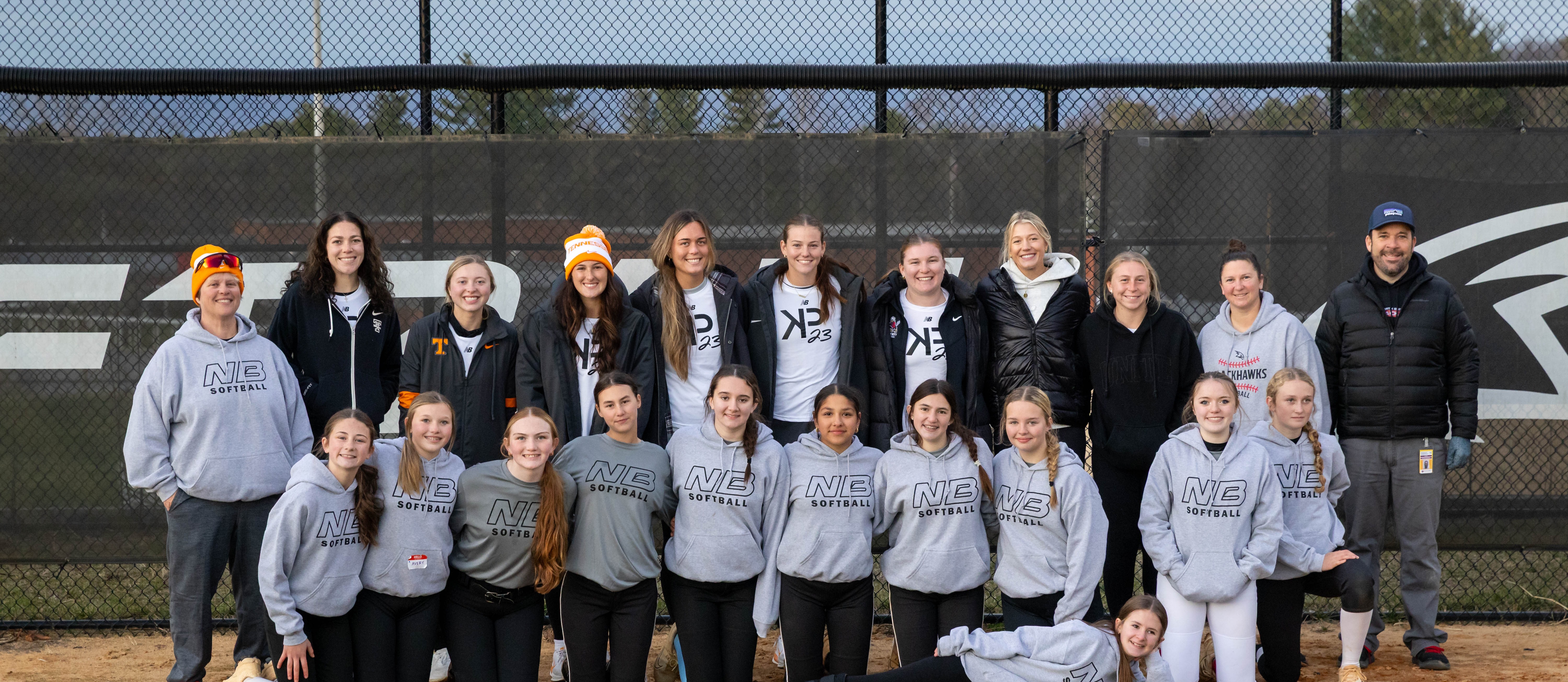 Image of Karlyn Pickens and Lady Vol teammates with the NBMS softball team after Kamp Karlyn