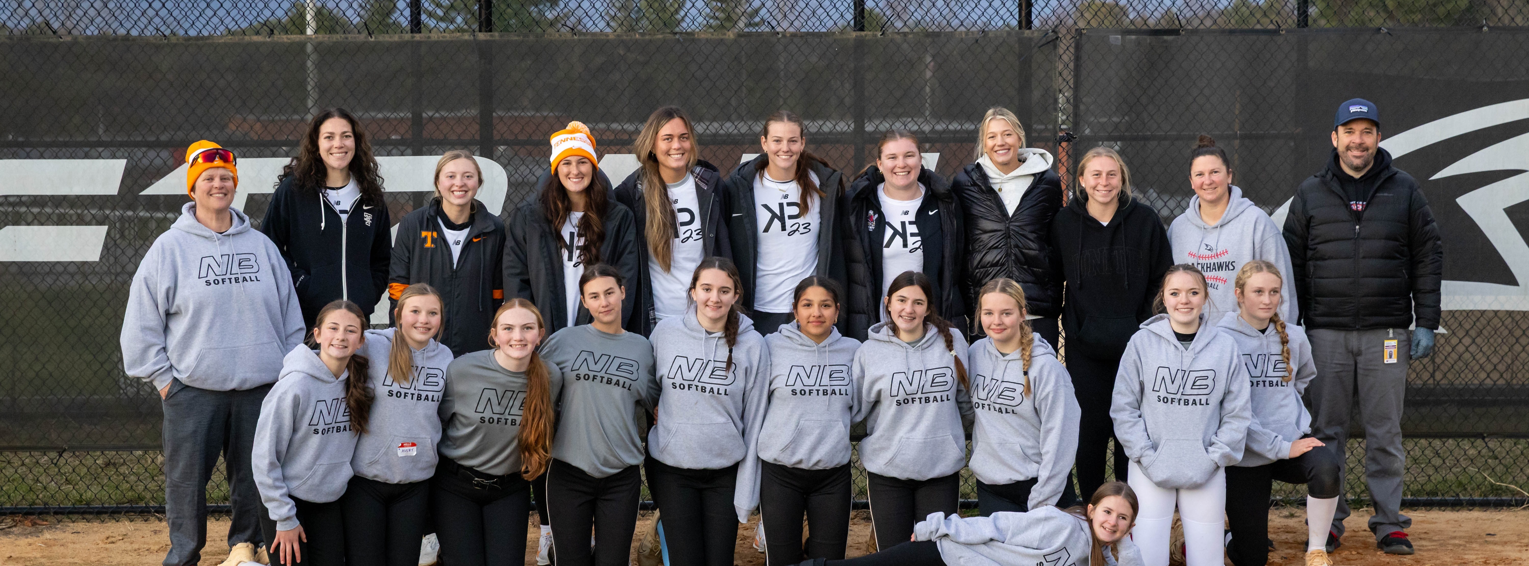 Image of Karlyn Pickens and Lady Vol teammates with the NBMS softball team after Kamp Karlyn