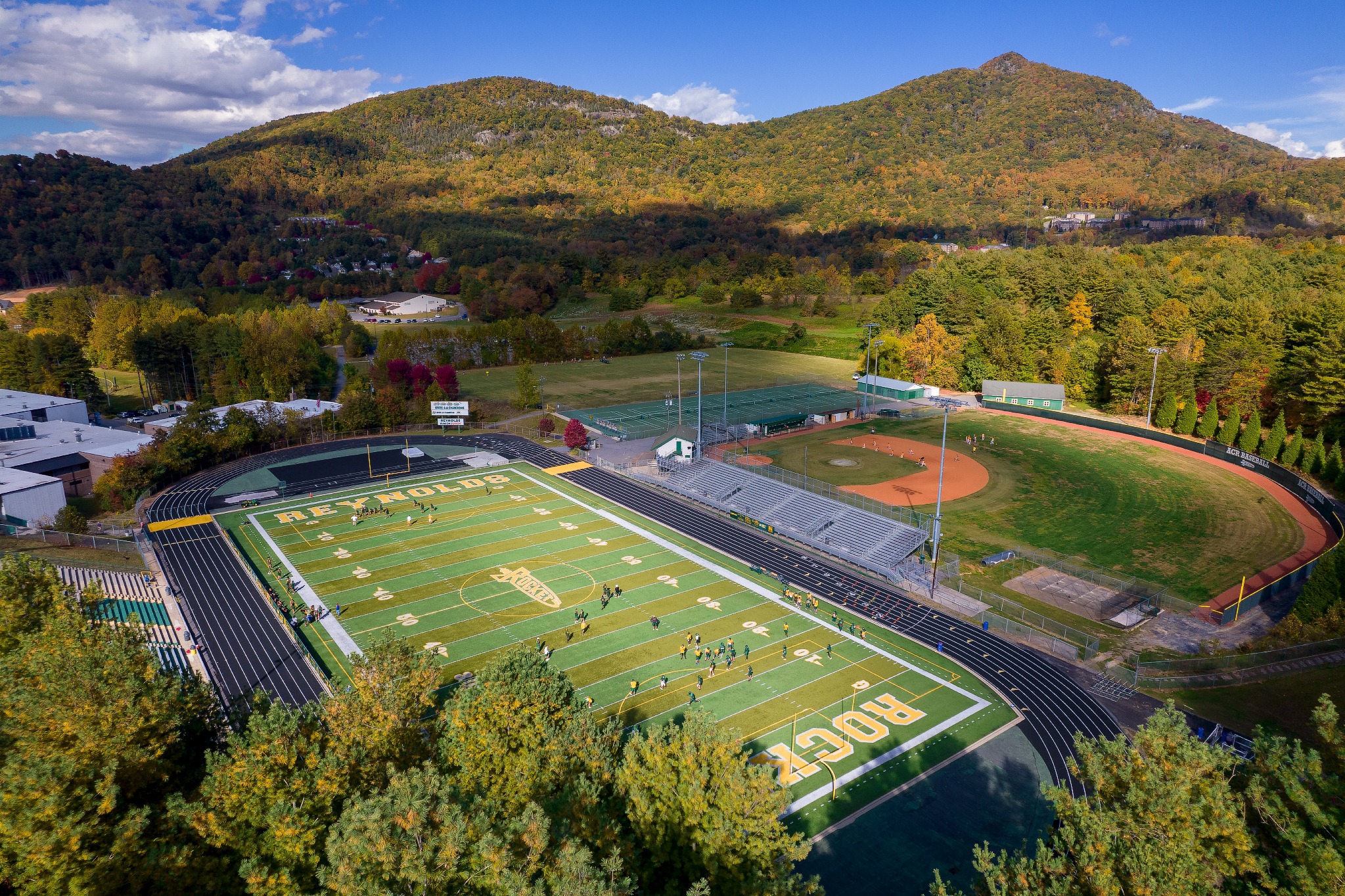 Drone footage of the football field in the fall.
