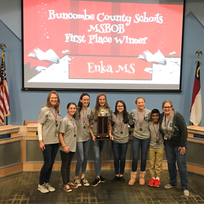 Battle of the Books club holding a  throphy