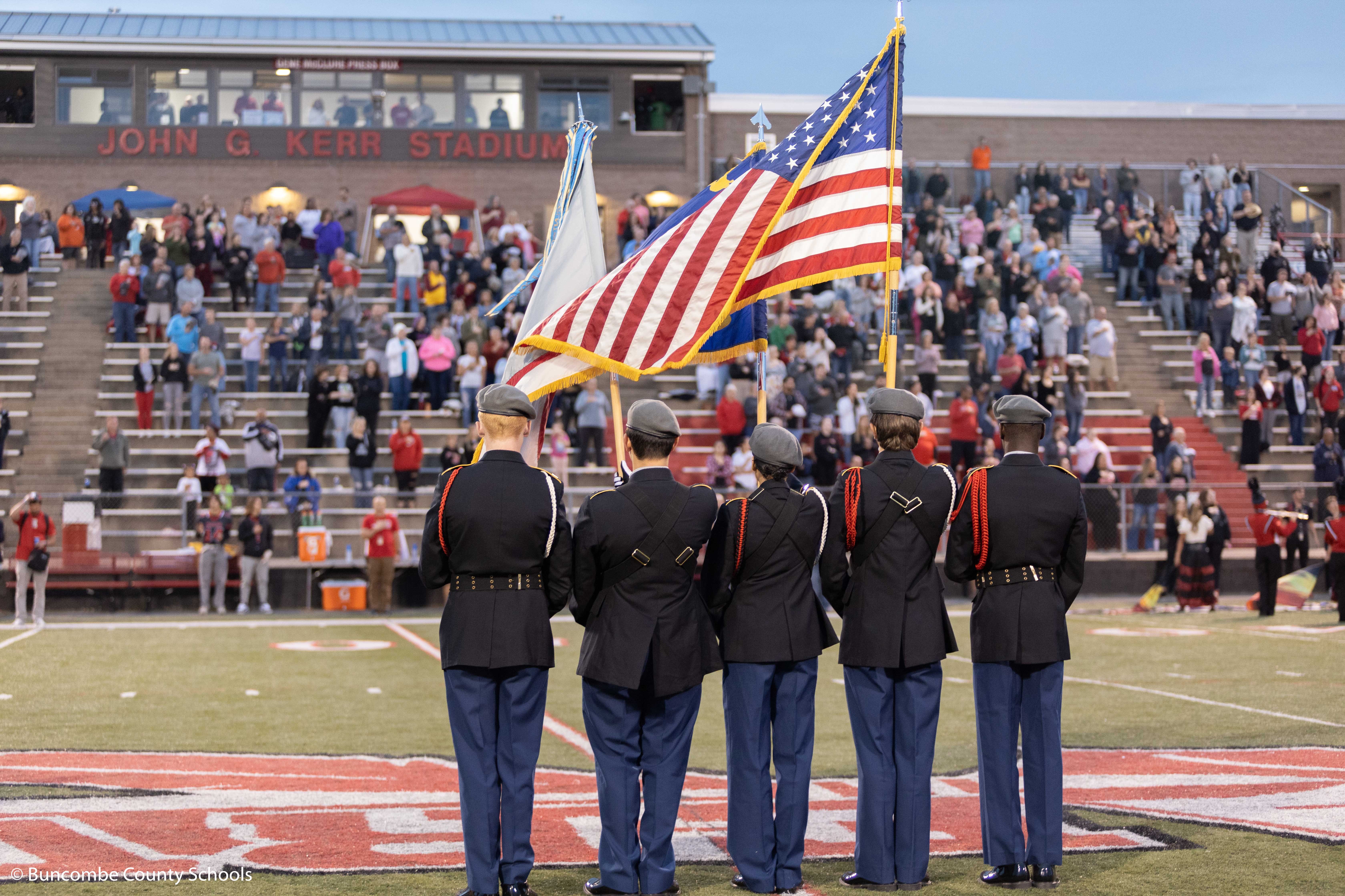 Erwin JROTC presenting the colors at a home football game. 
