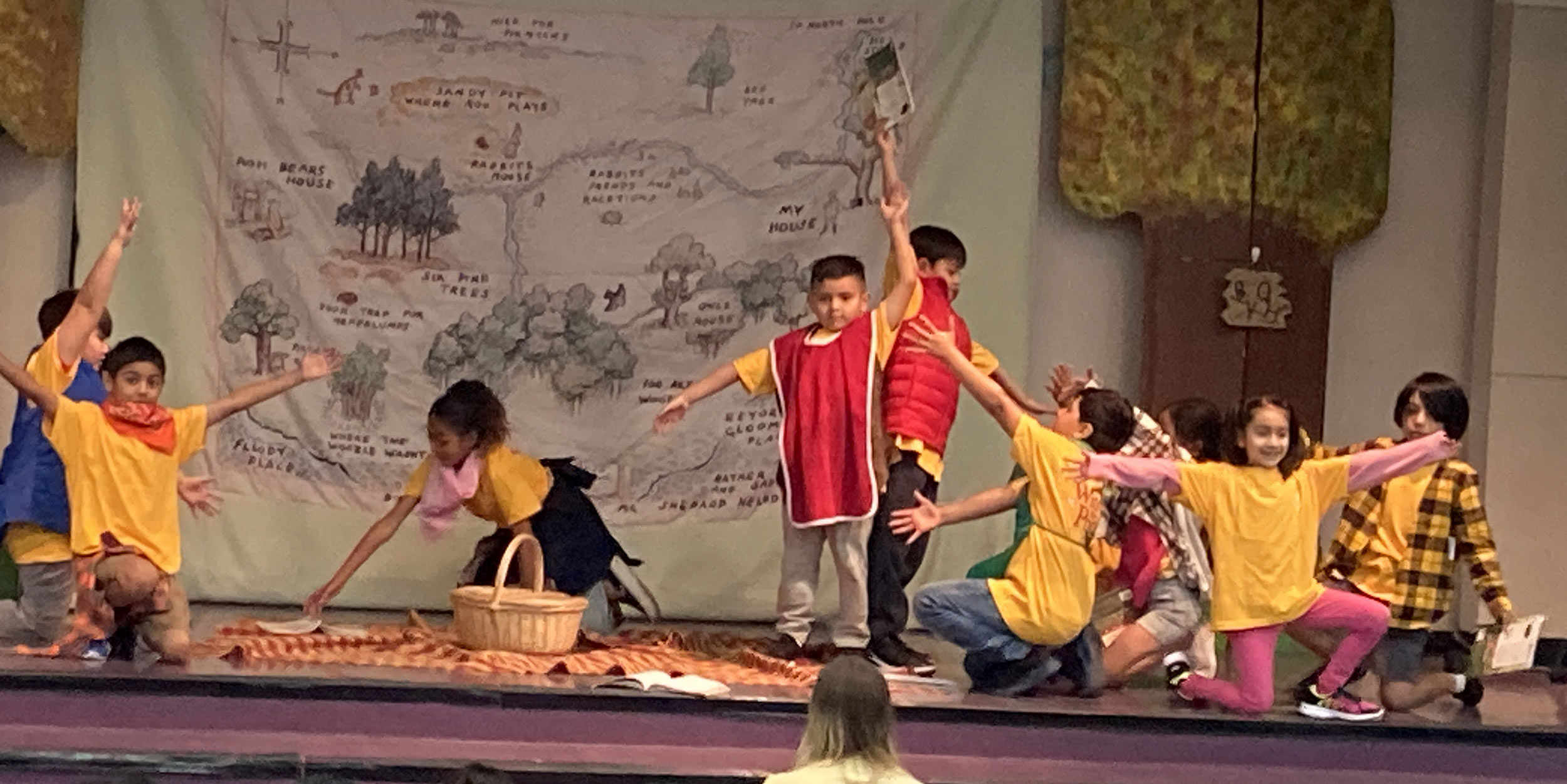 Farr students performing Winnie the Pooh on stage