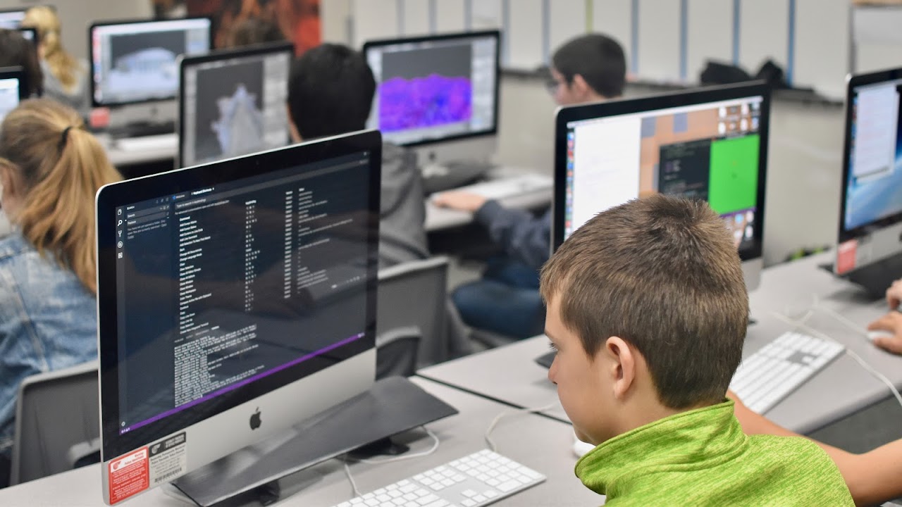 Student programming on computer image