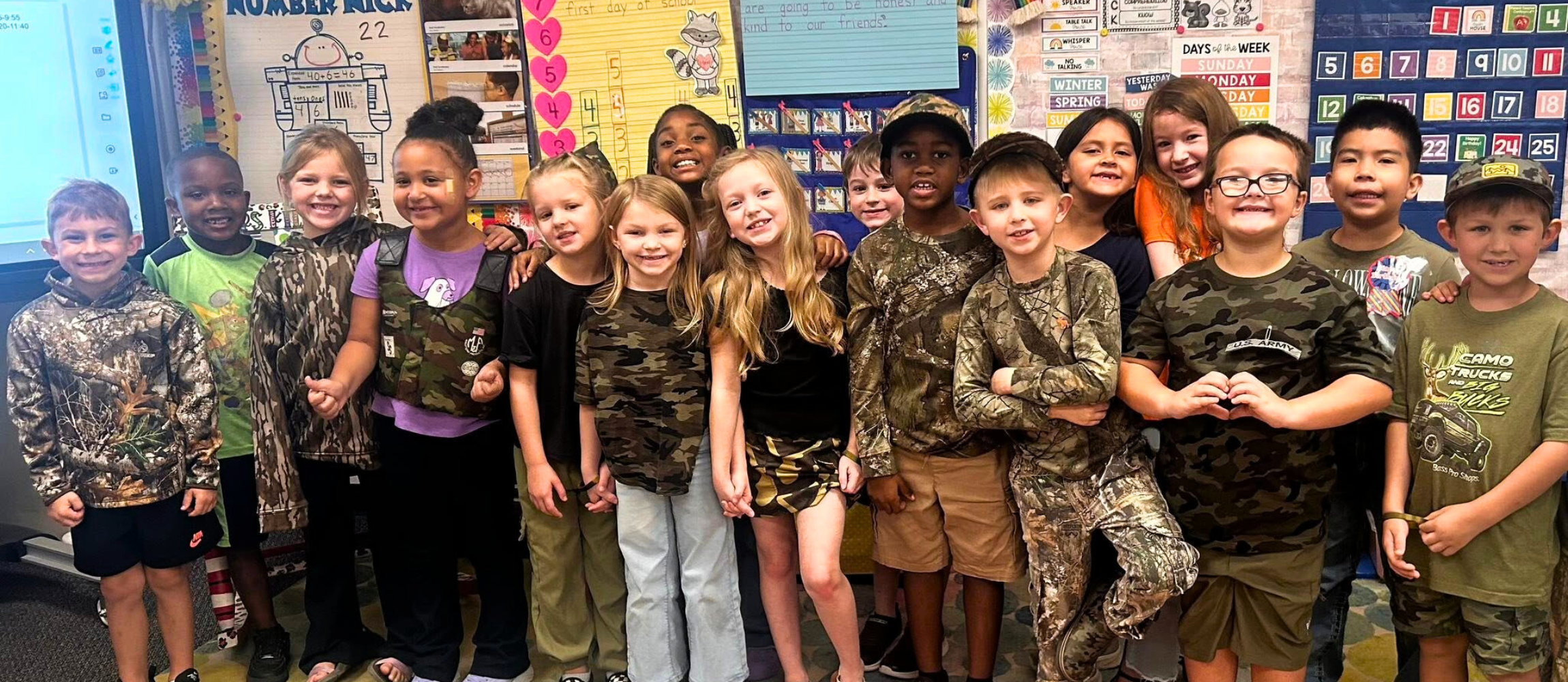 Primary students dressed in camo