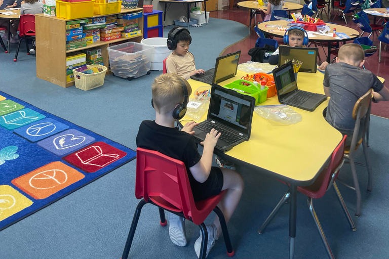 students looking at a computer
