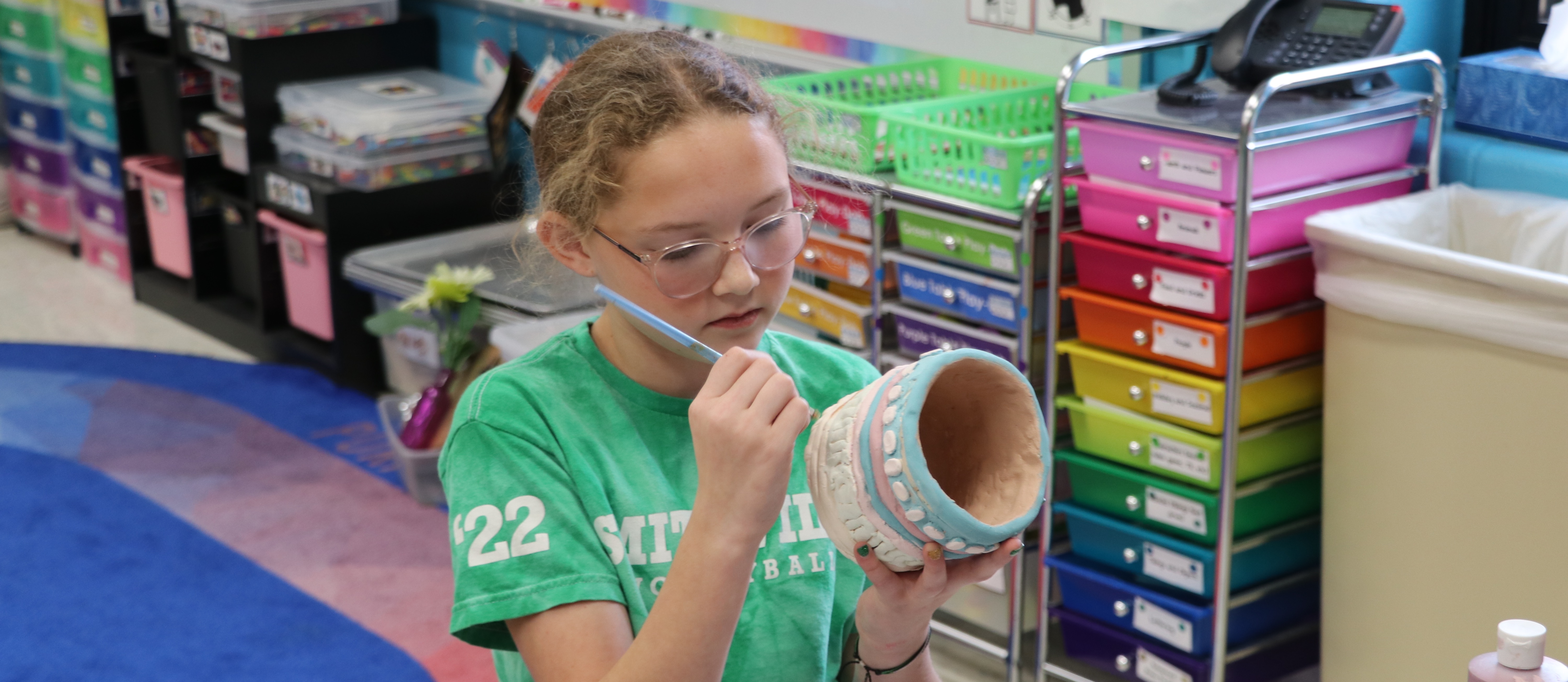 Girl works on art project