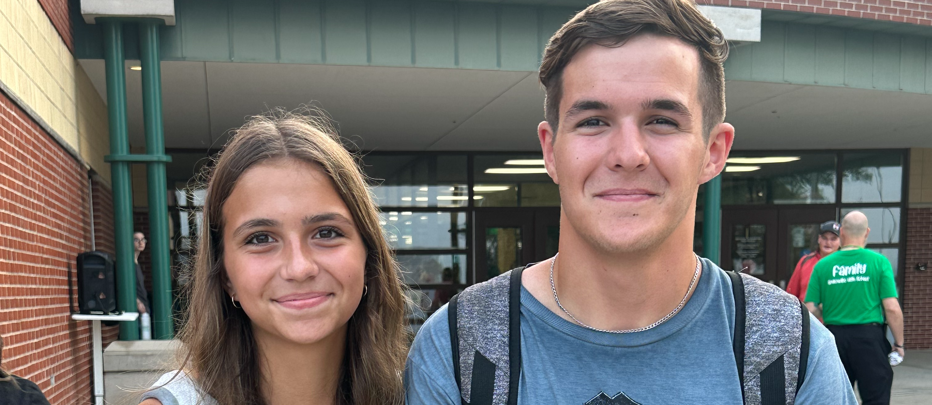brother and sister pose for photo on the first day of school