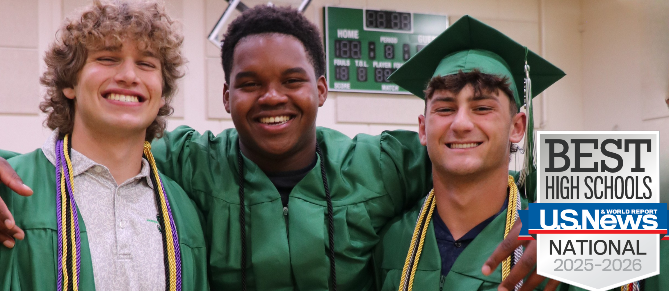 Three senior boys wrap their arms around each other on graduation day. They are wearing graduation gowns. There is a logo of US News and World Reports Best High Schools in the bottom right corner.