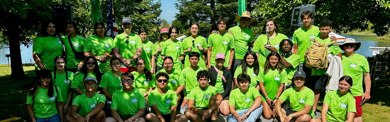 students in lime green shirts outside