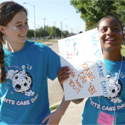 students walking towards the school with diy flyers