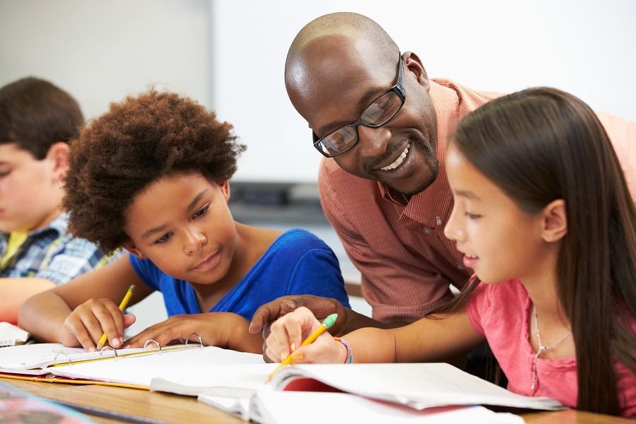 teacher helping students