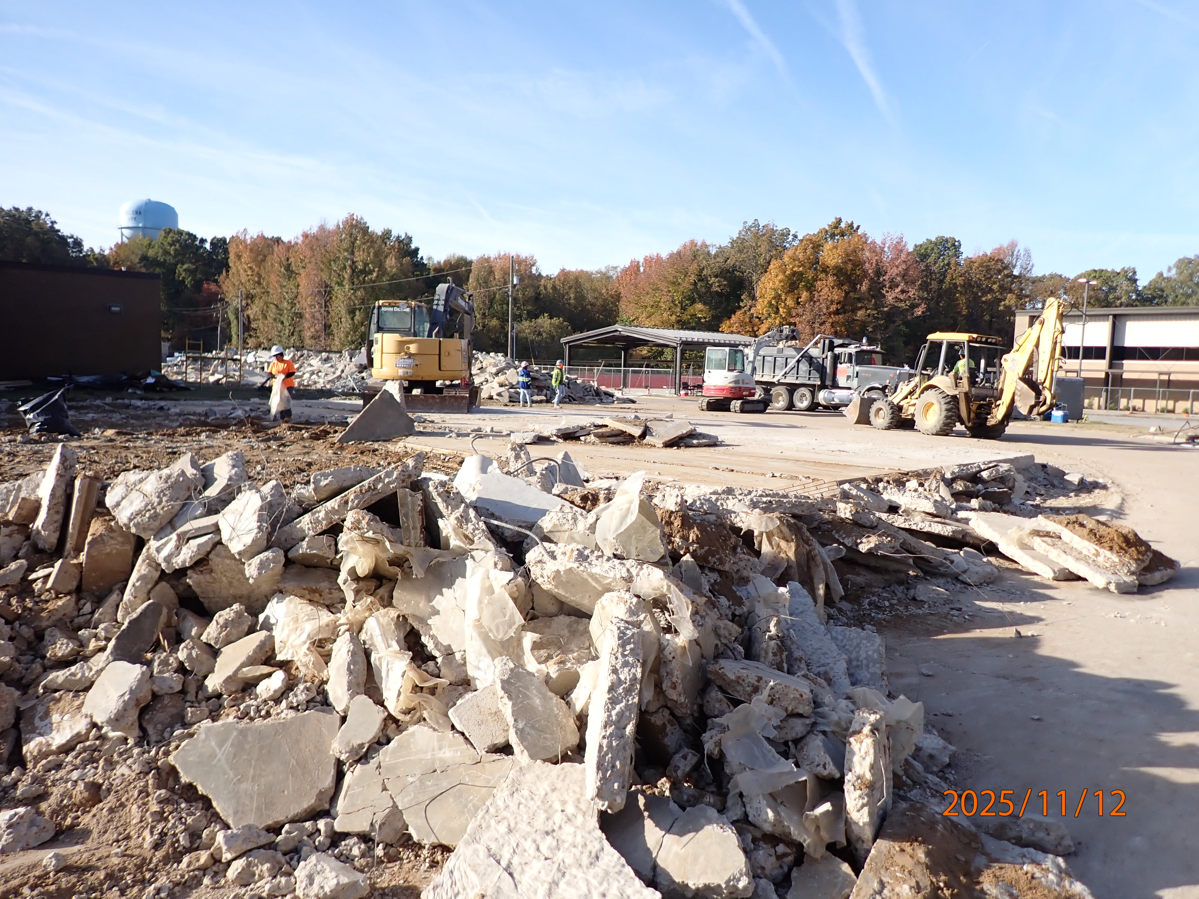 Construction crew continuing to demolition the building and slab.