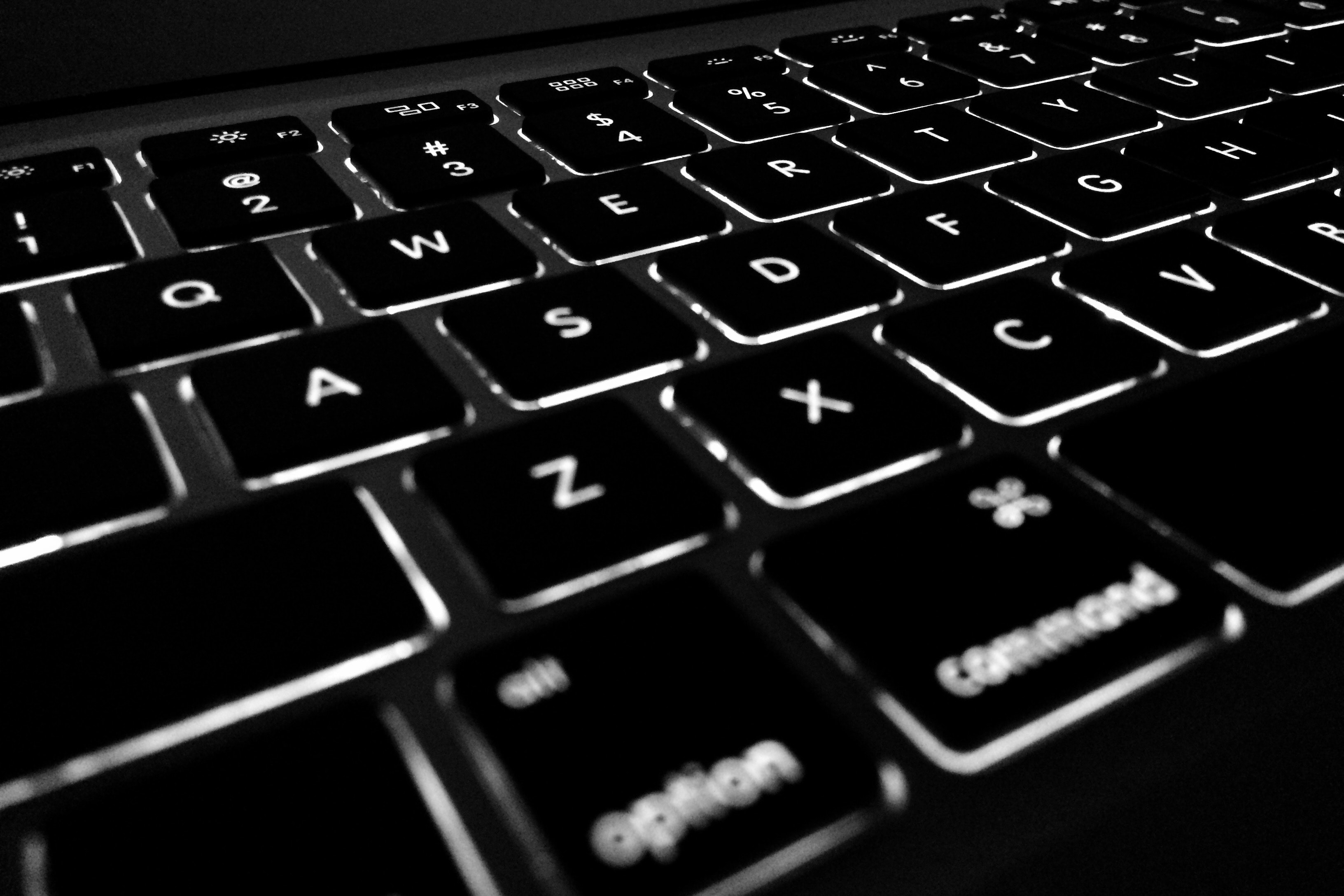 stock photo of black qwerty keyboard with backlit white letters