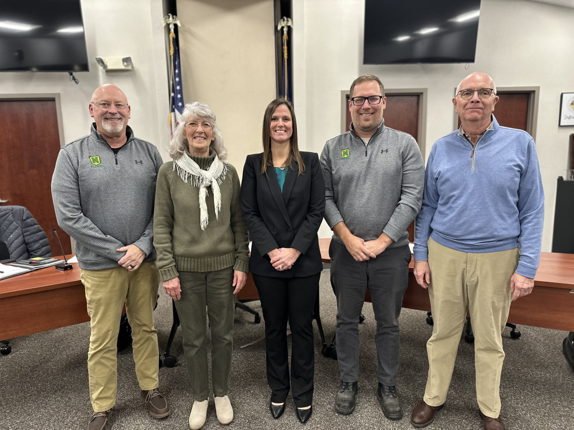 Group photo of the five current school board members standing in the MCS boardroom (left to right: Gregg Eash,  Cindy Nisley, Kate Hummel, Caleb Mast and Donald Anderson)