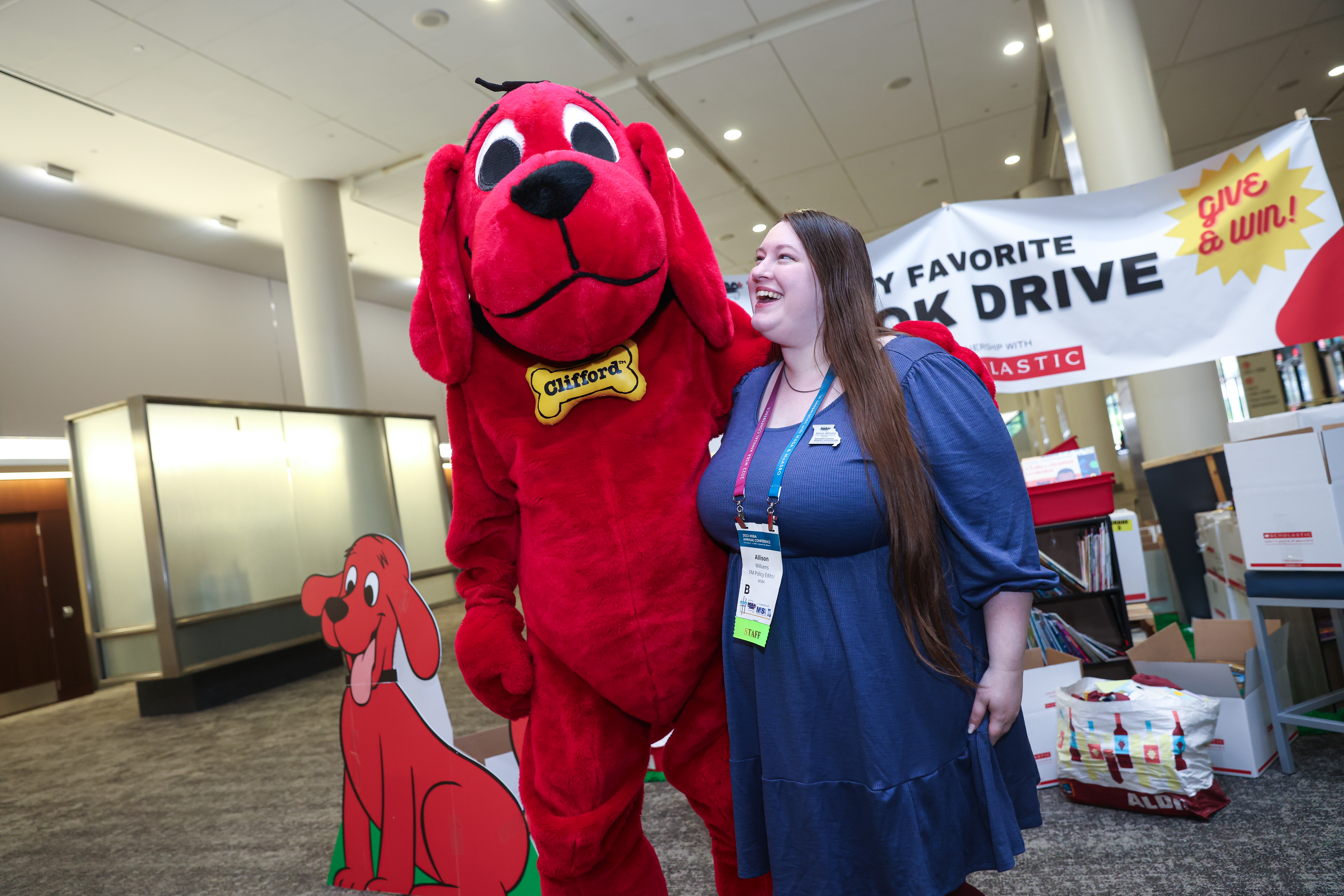 woman with Clifford the big red dog