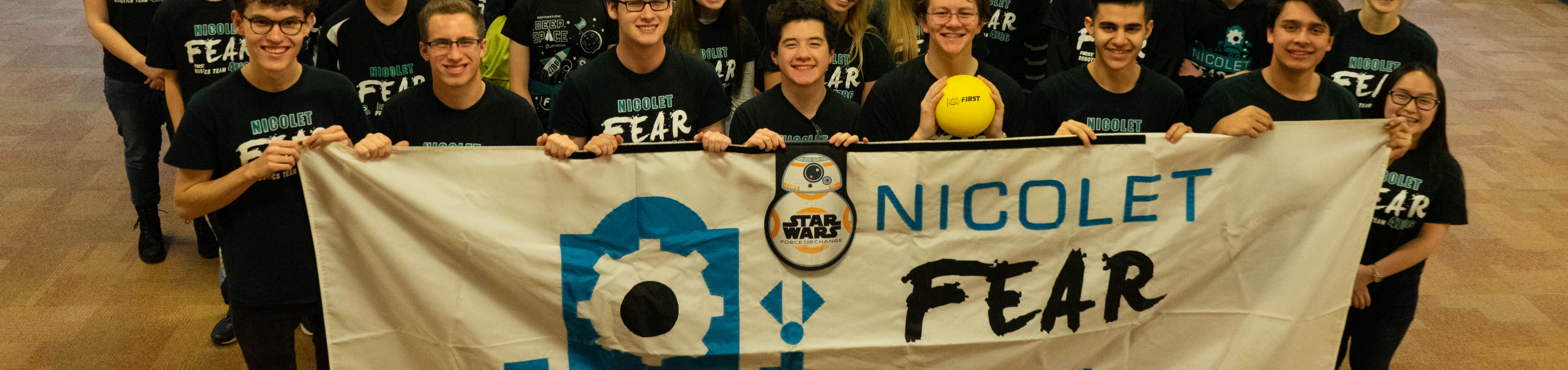 picture of students holding a nicolet fear sign