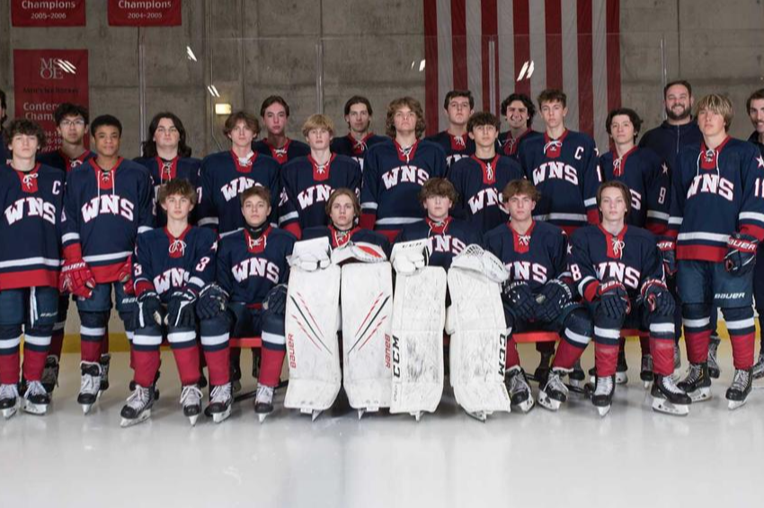 team picture of the varsity boys hockey team posing for a picture