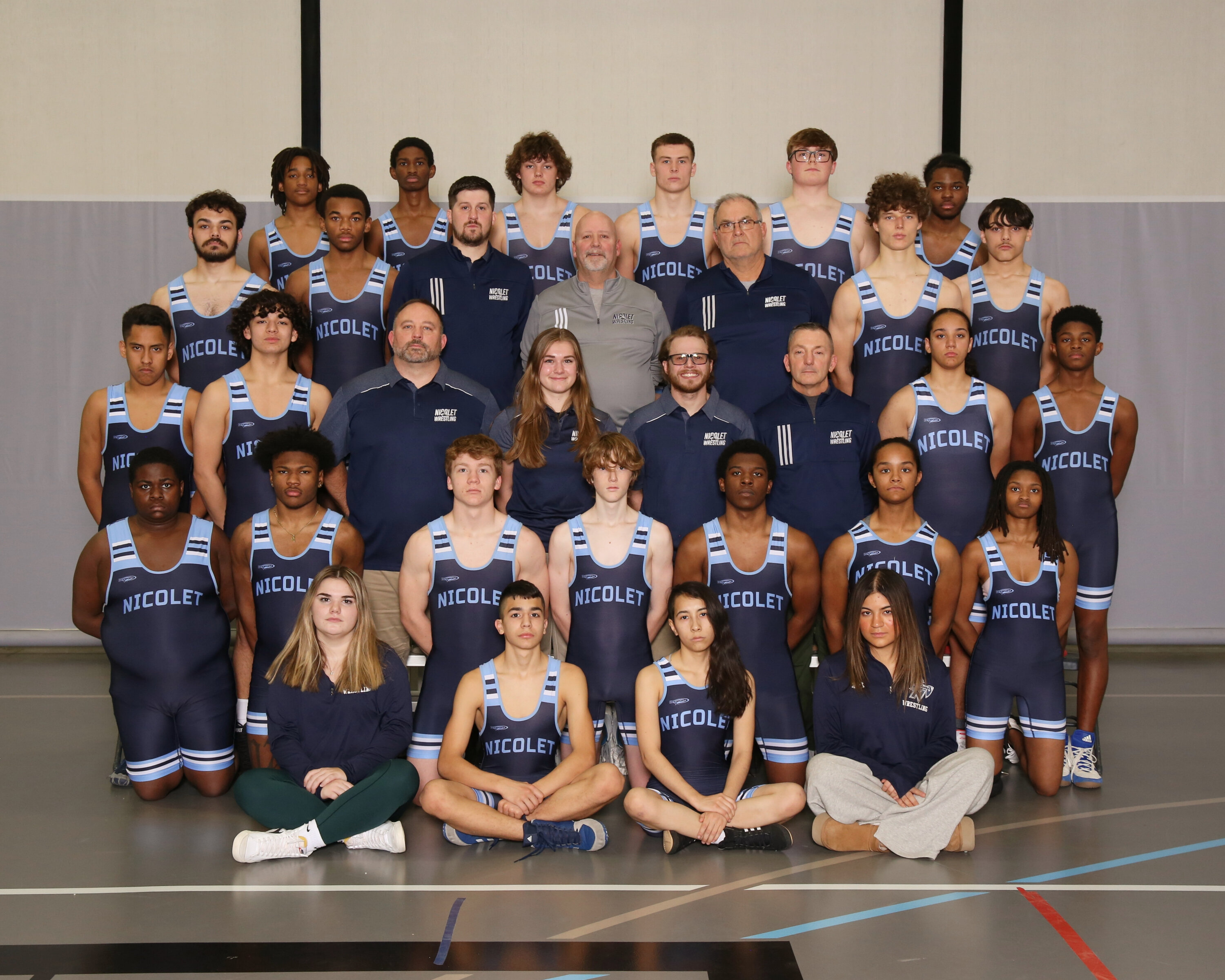 team picture of the nicolet wrestling team posing for a picture