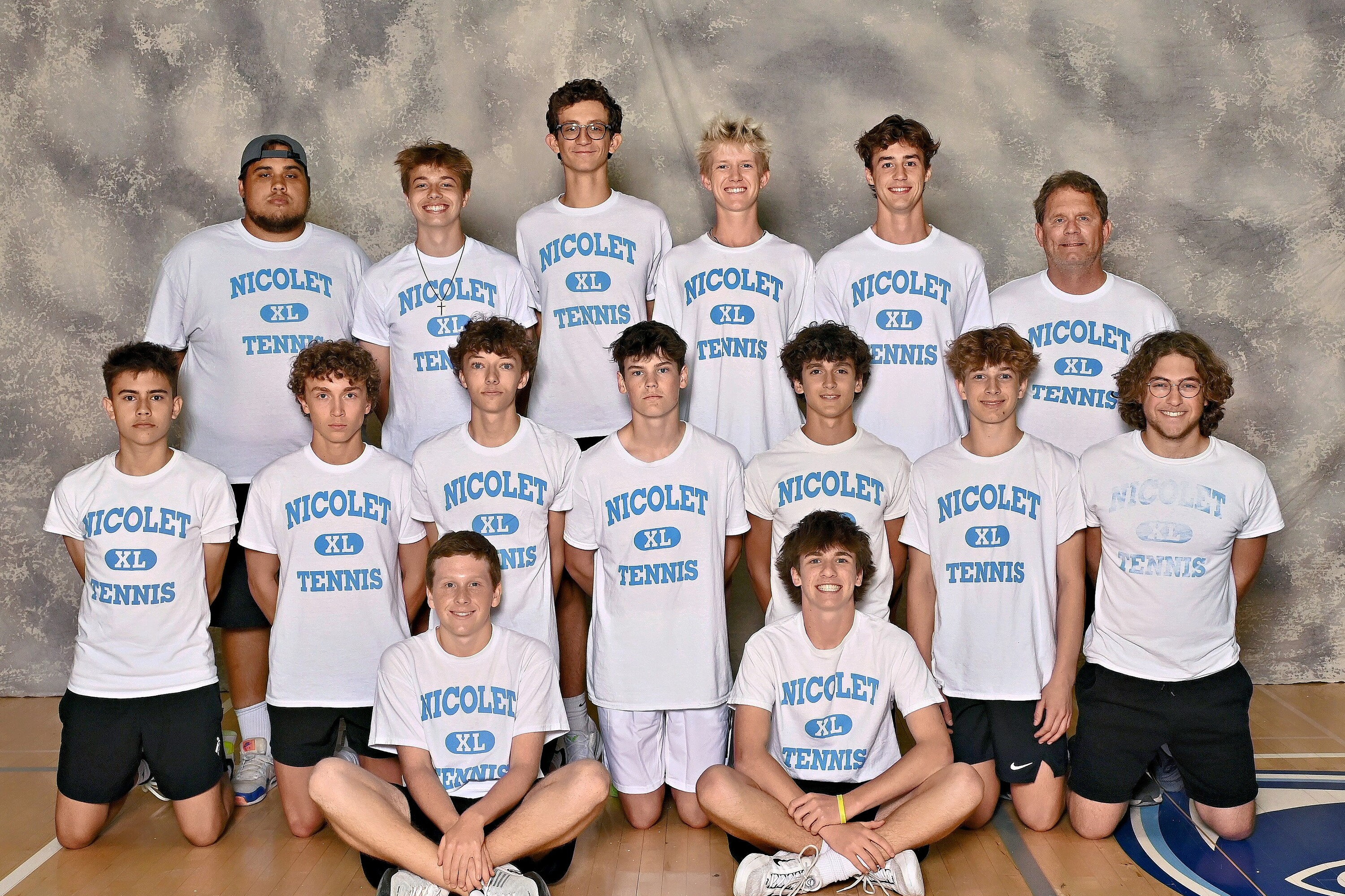 team picture of the boys tennis team posing for a picture 